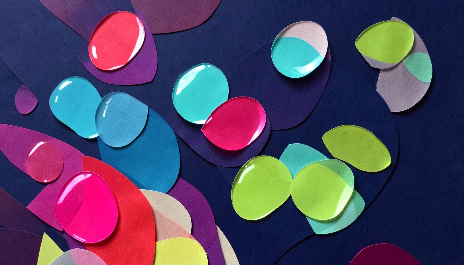 Layered paper cut-out collage of glossy translucent bubbles in bright pink, turquoise, and lime green floating upward against a soft cream background, cheerful and fresh mood.